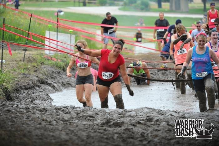 Participants overcoming the mud obstacle!
